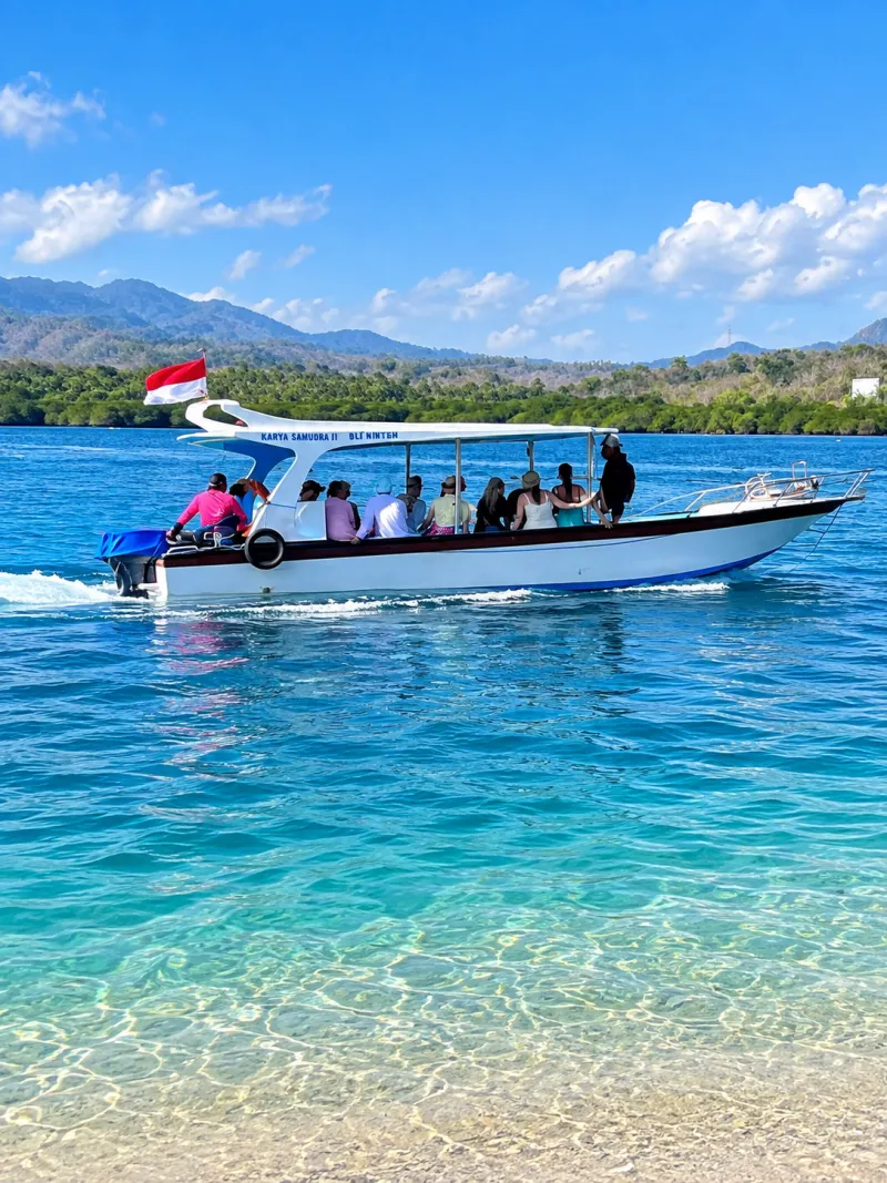 Snorkeling boat with guests on turquoise water on the way to Menjangan Island